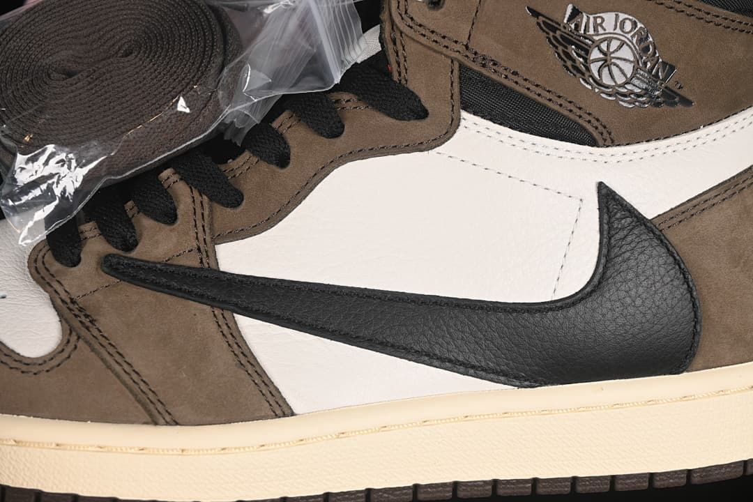 Close-up of the reverse-style black Swoosh, brown overlays, and white side panel