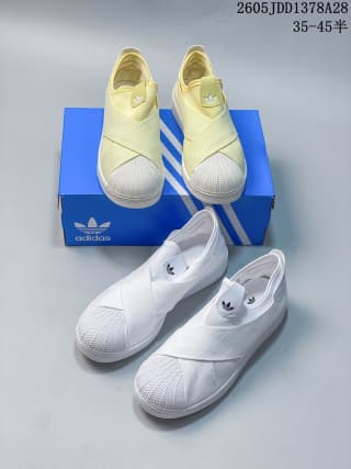 White and pale yellow slip-on shoes with crossed straps displayed together.