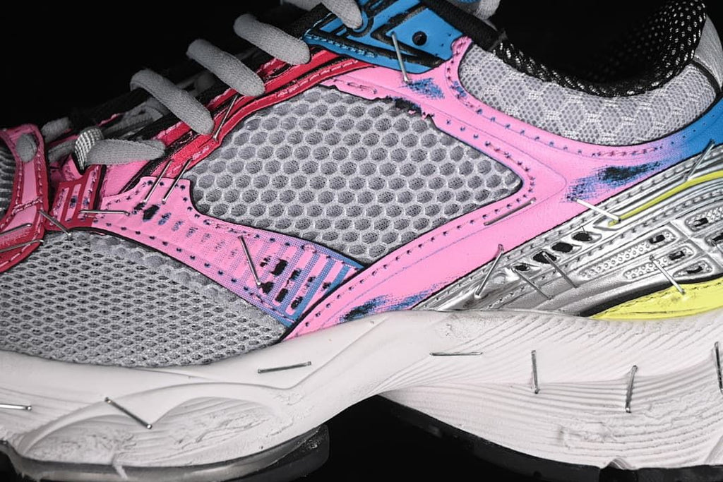 Close-up of the grey mesh-look side panel and colorful overlays