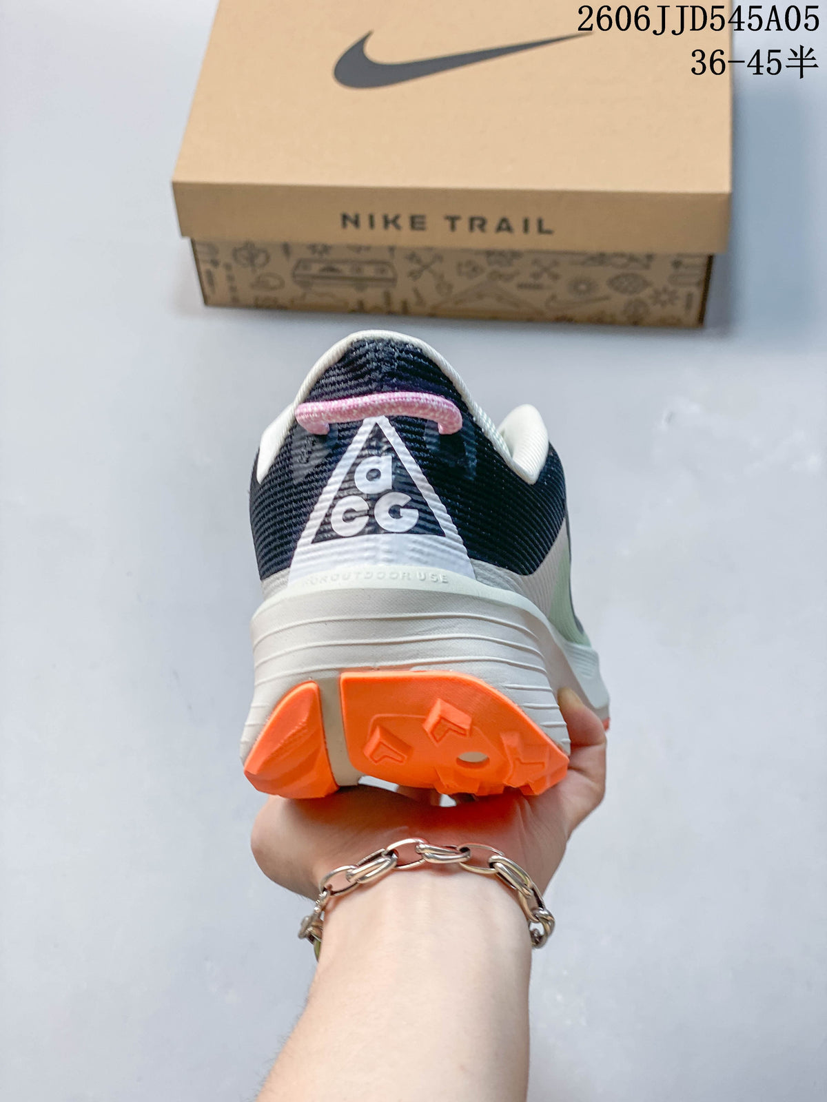Rear view of a Nike ACG Pegasus Trail 6 shoe showing the heel and orange outsole.