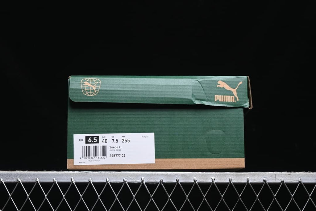 Shoe box label displaying Suede XL, style 395777 02, and sample size details.