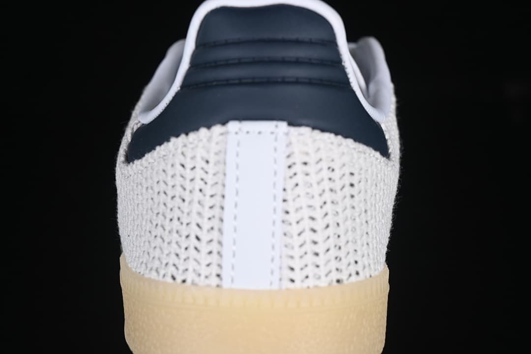 Rear view of the white textured heel with navy heel detail and gum-look sole