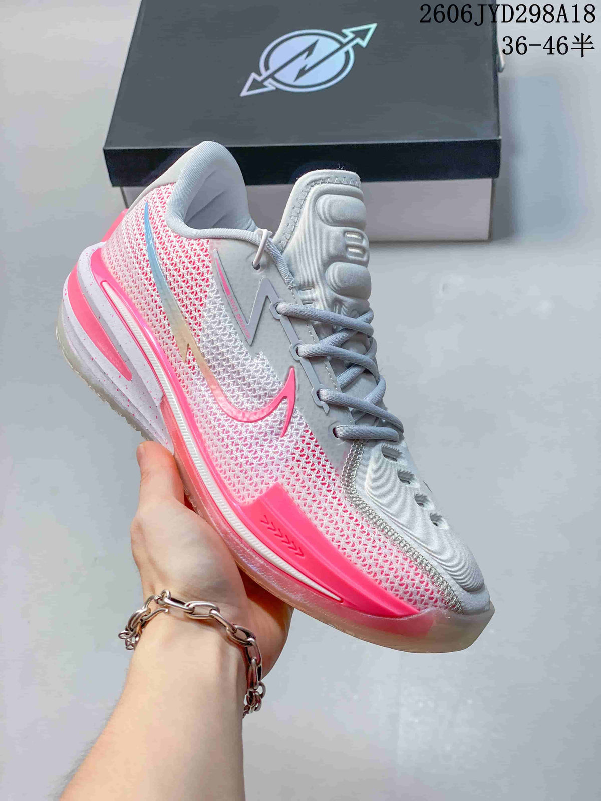 Angled side view highlighting the pink side panels and low-top profile.