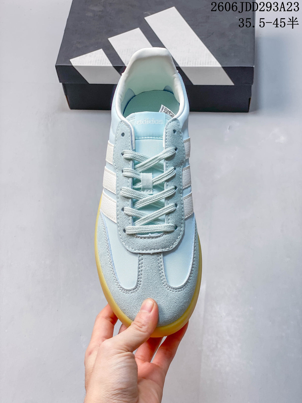 Top view of the lace-up sneaker with light blue and white panels