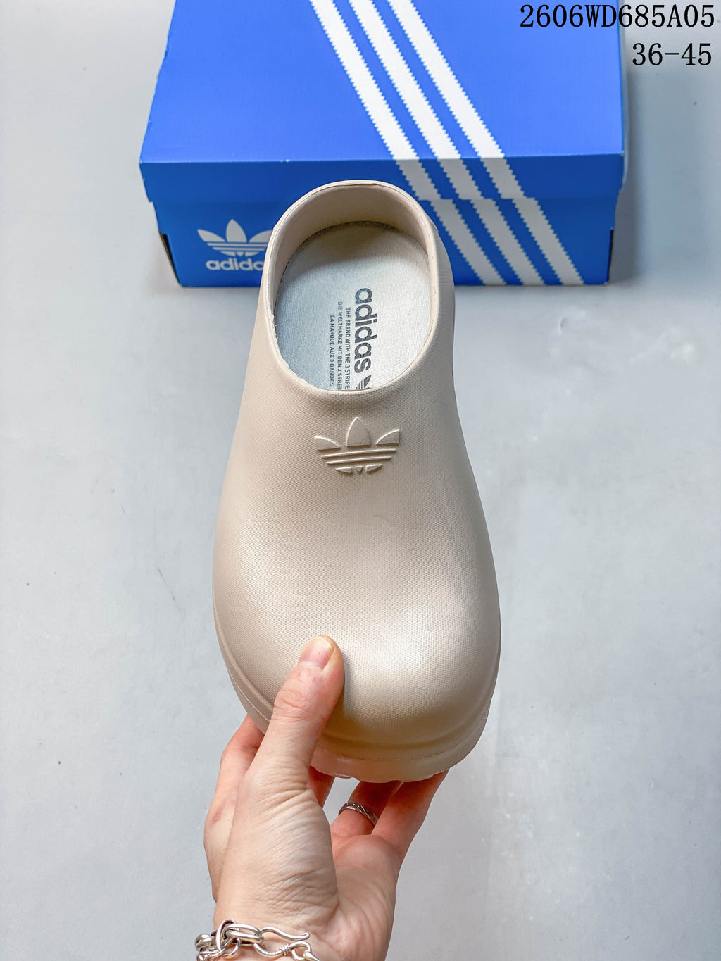 Top view of a light beige adidas AdiFOM Stan Smith Mule clog with Trefoil branding.