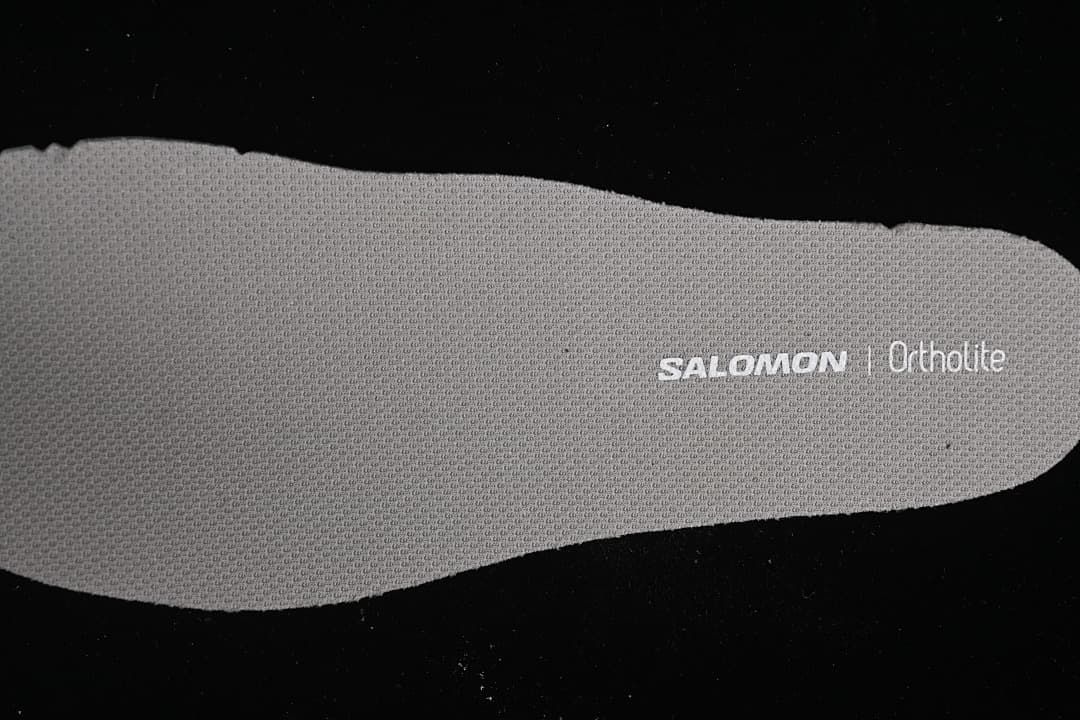 Close-up of a gray insole marked Salomon and Ortholite.