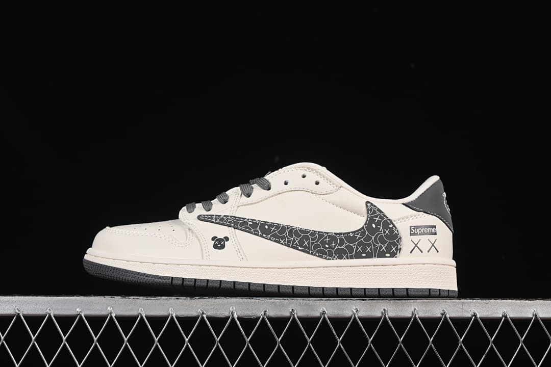 Side view of an off-white low-top sneaker with dark patterned panels, graphic accents, and Supreme text.