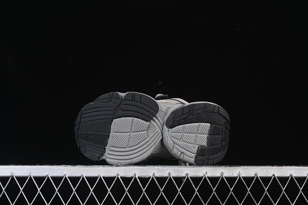 Underside view showing the segmented, patterned outsoles.