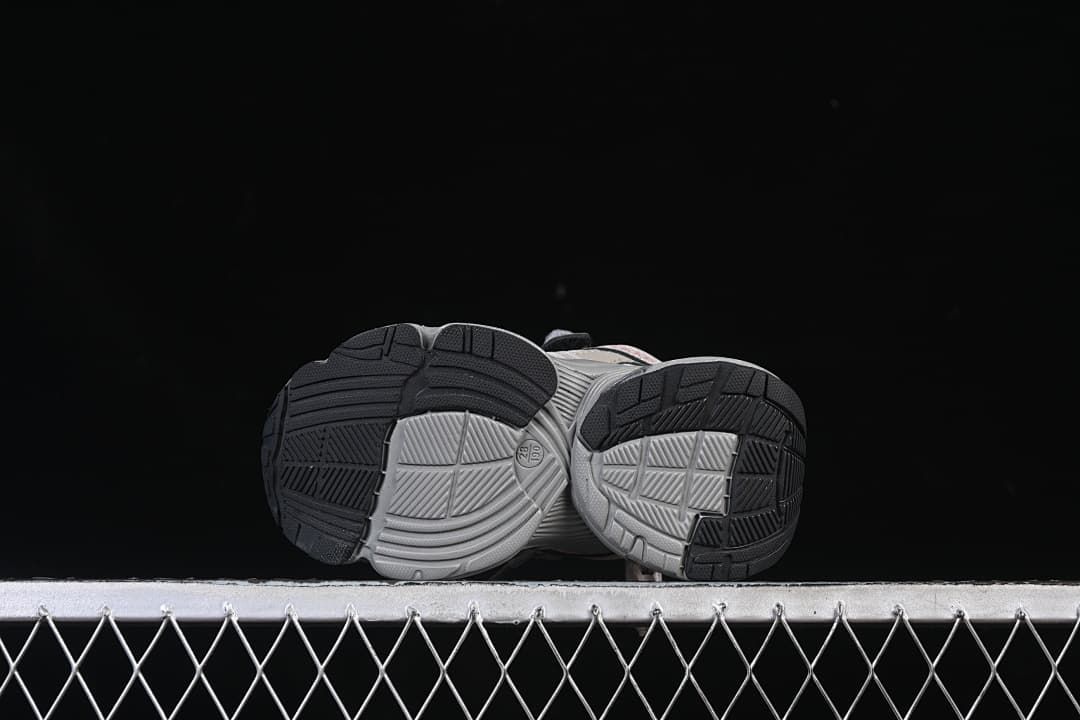 Underside view showing the segmented, patterned outsoles.