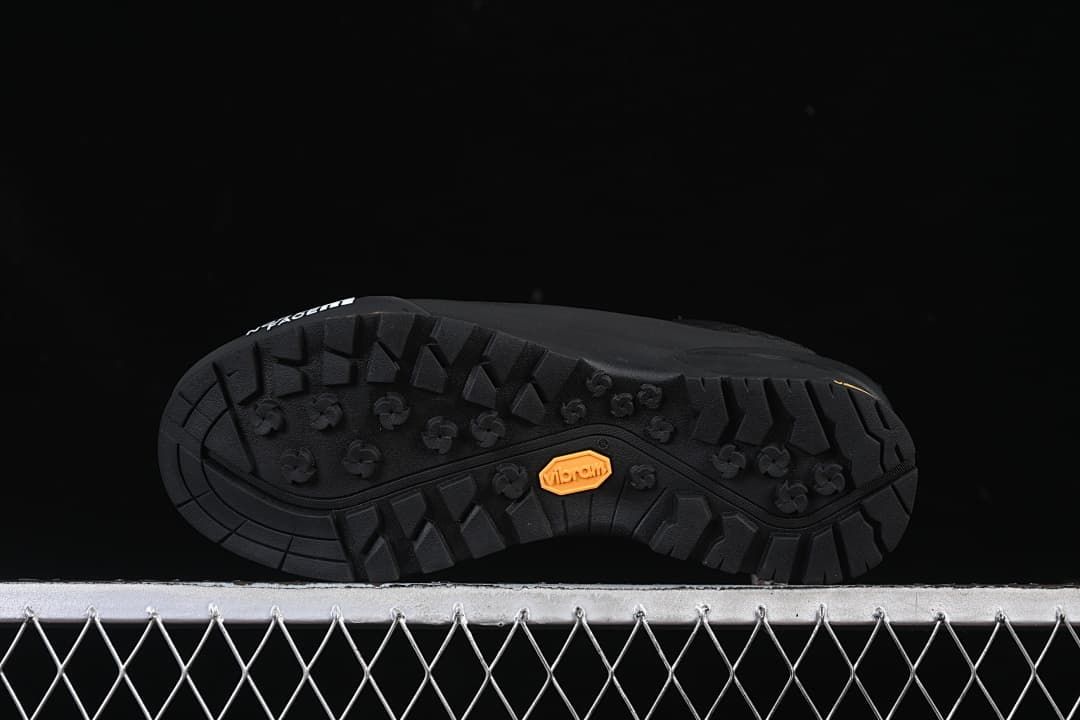 Underside view showing the lugged outsole and Vibram branding.