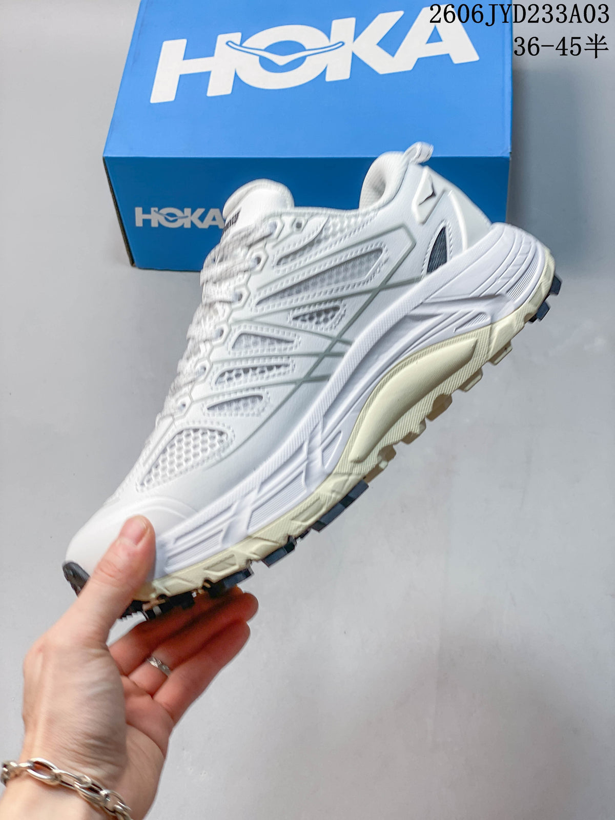 Side profile of a white HOKA Mafate Speed trail shoe