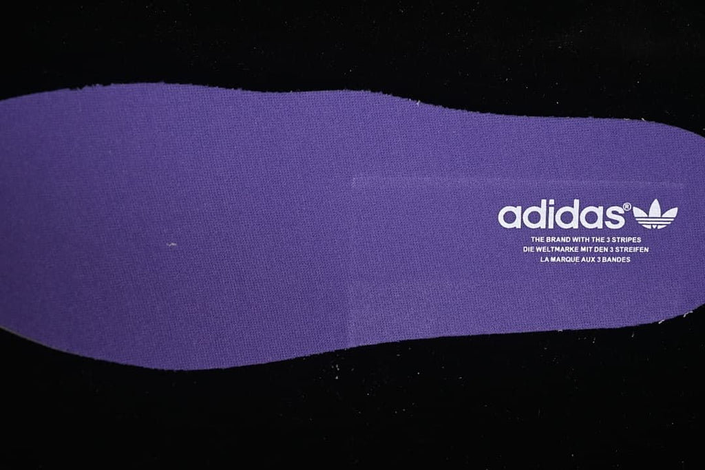 Purple insole with adidas Trefoil branding
