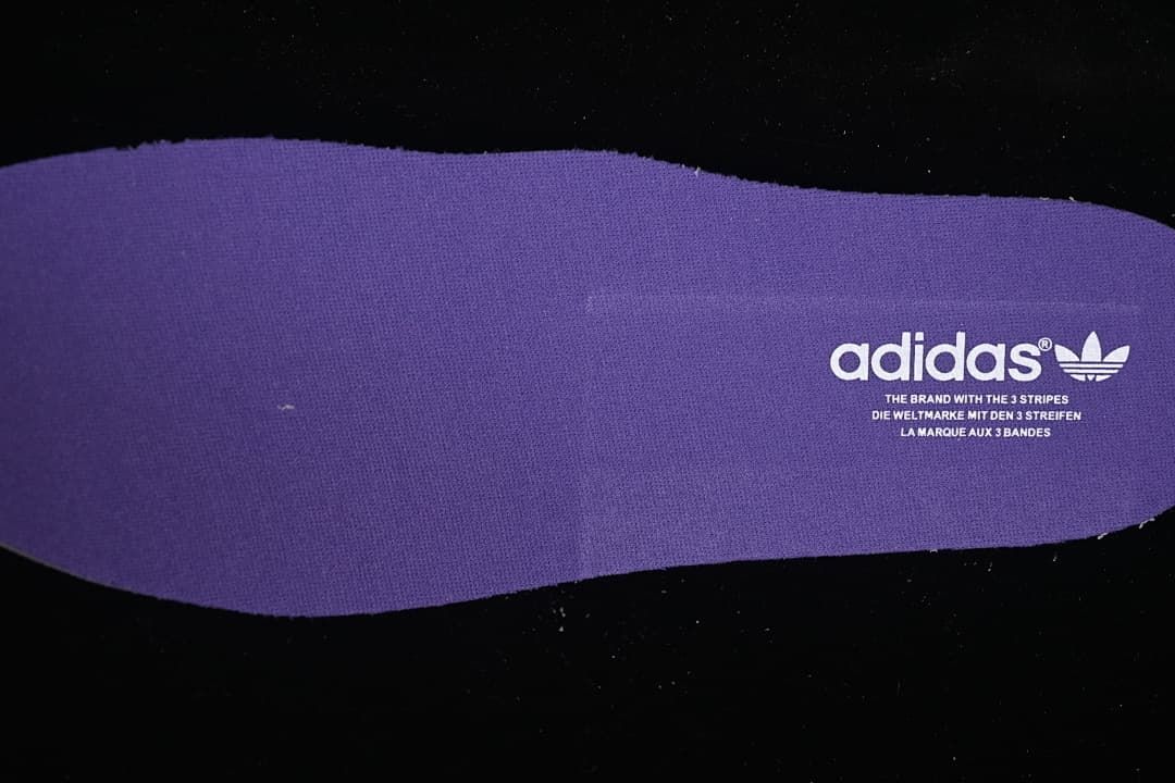Purple insole with adidas Trefoil branding