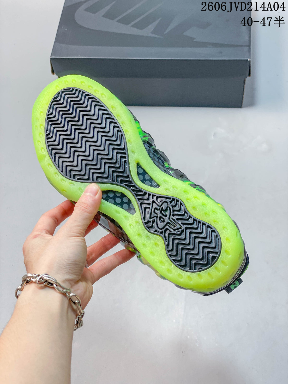 Bottom view showing the dark patterned outsole and translucent-looking volt-green perimeter.