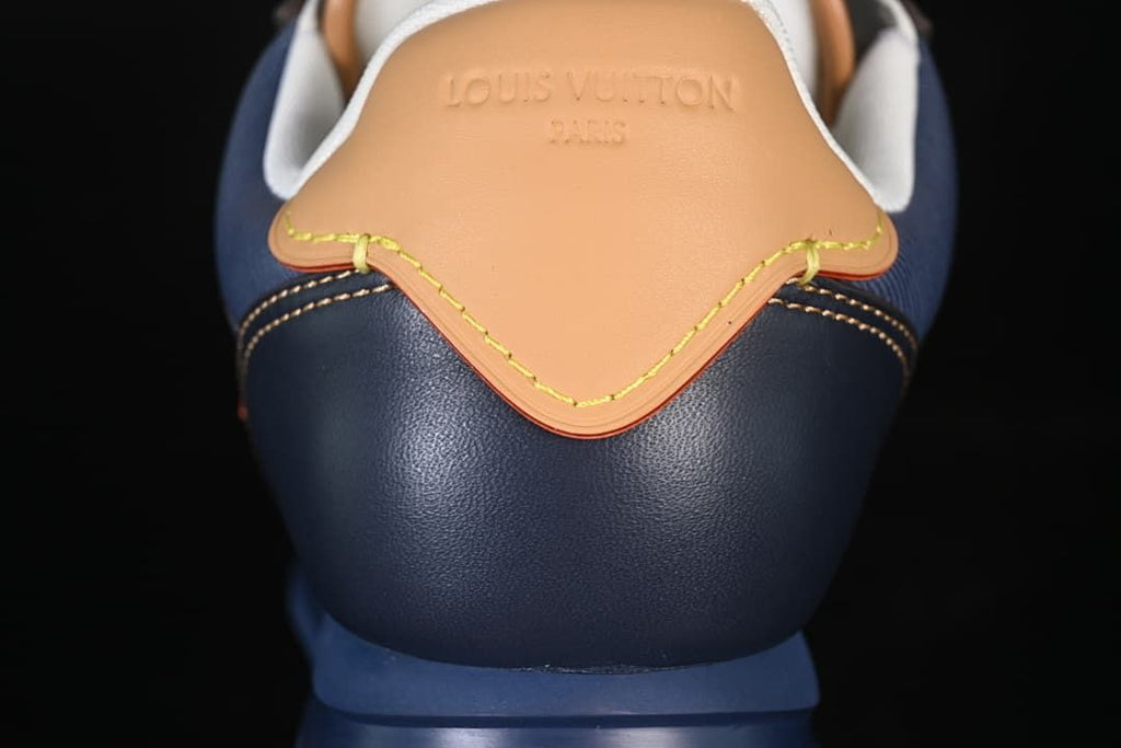 Close-up of the tan heel tab with contrast stitching