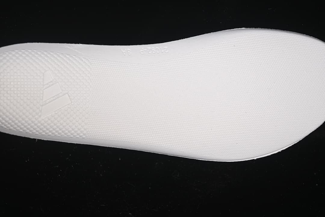 Close-up of the white outsole with subtle adidas branding