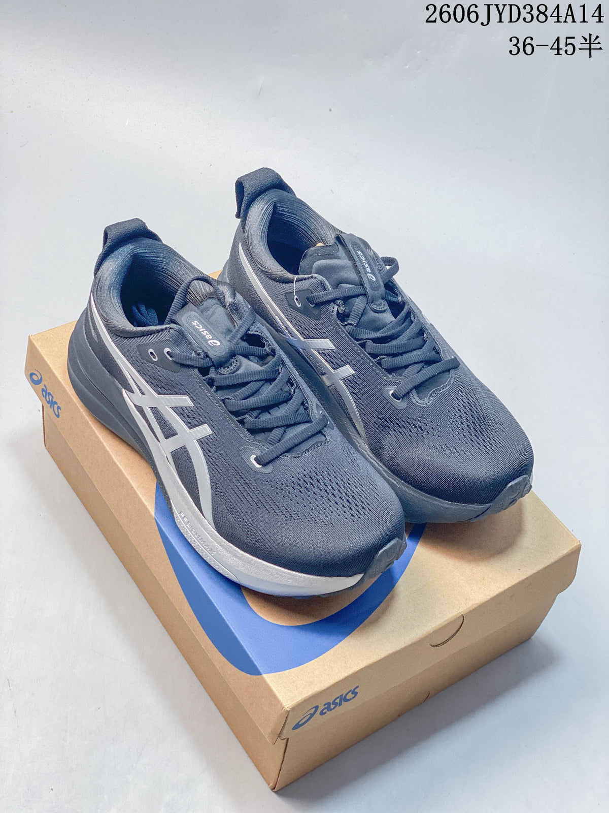 Pair of dark navy and silver ASICS GEL-KAYANO 33 running shoes on an ASICS shoebox