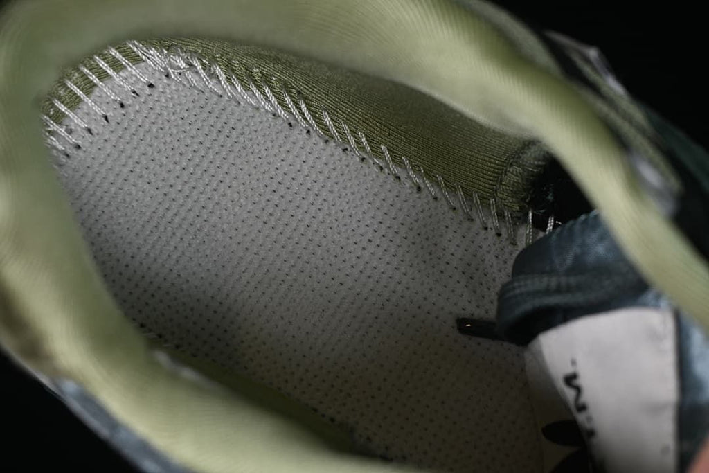 Close-up of the sneaker's padded interior and stitching.