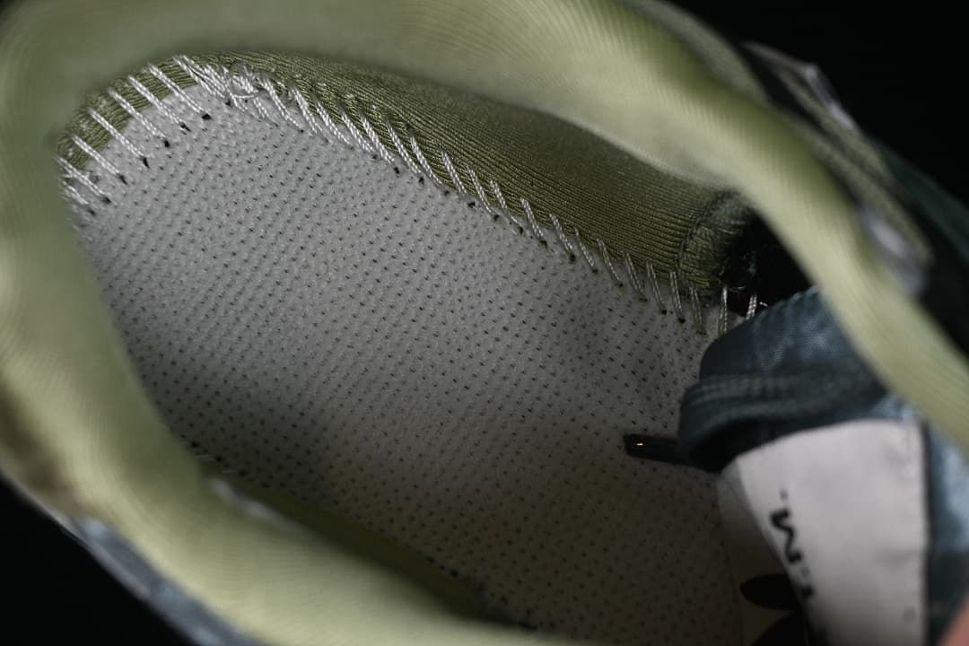 Close-up of the sneaker's padded interior and stitching.