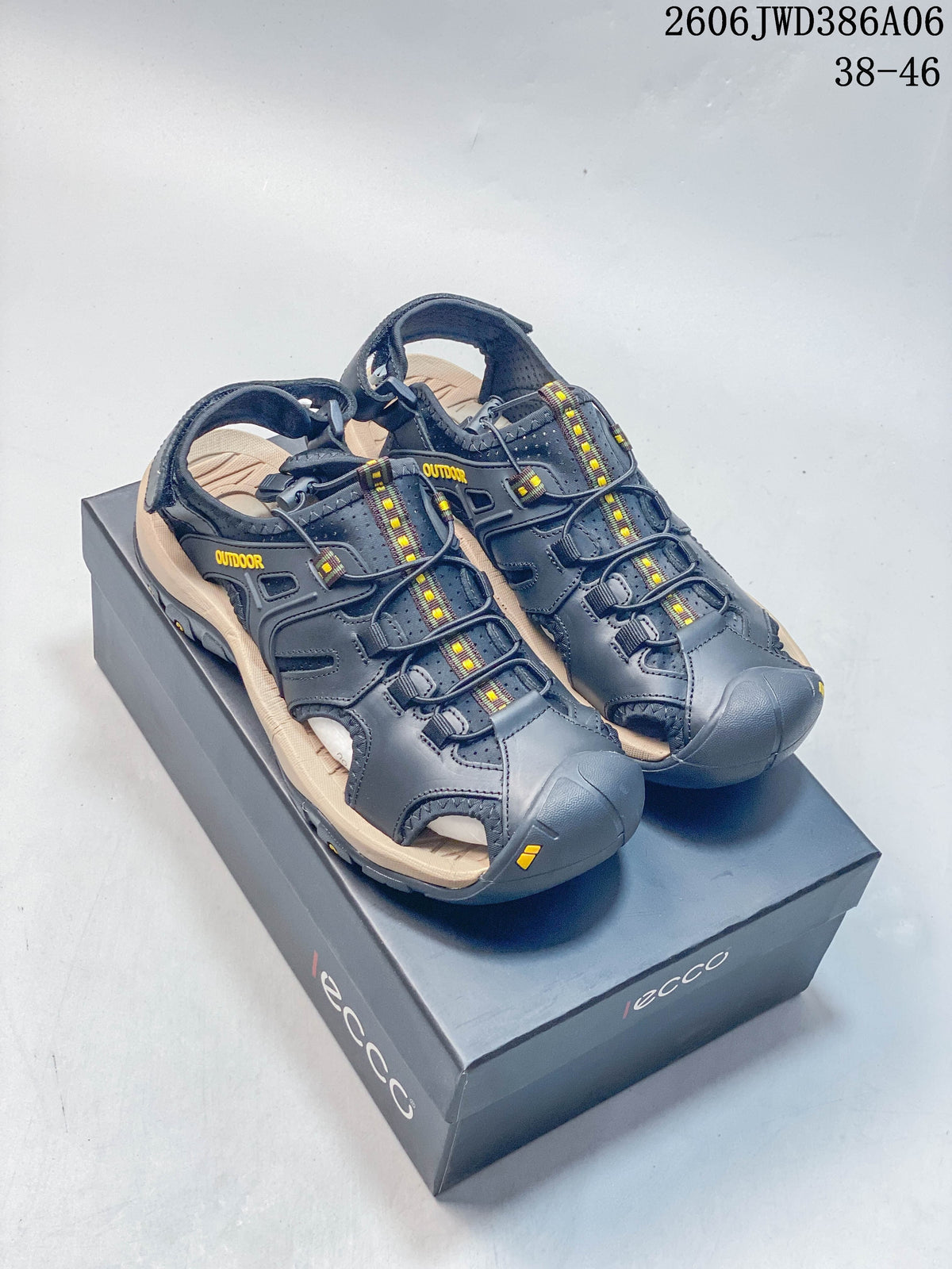Dark gray ECCO closed-toe outdoor sandals with beige-toned soles, shown on a branded box.