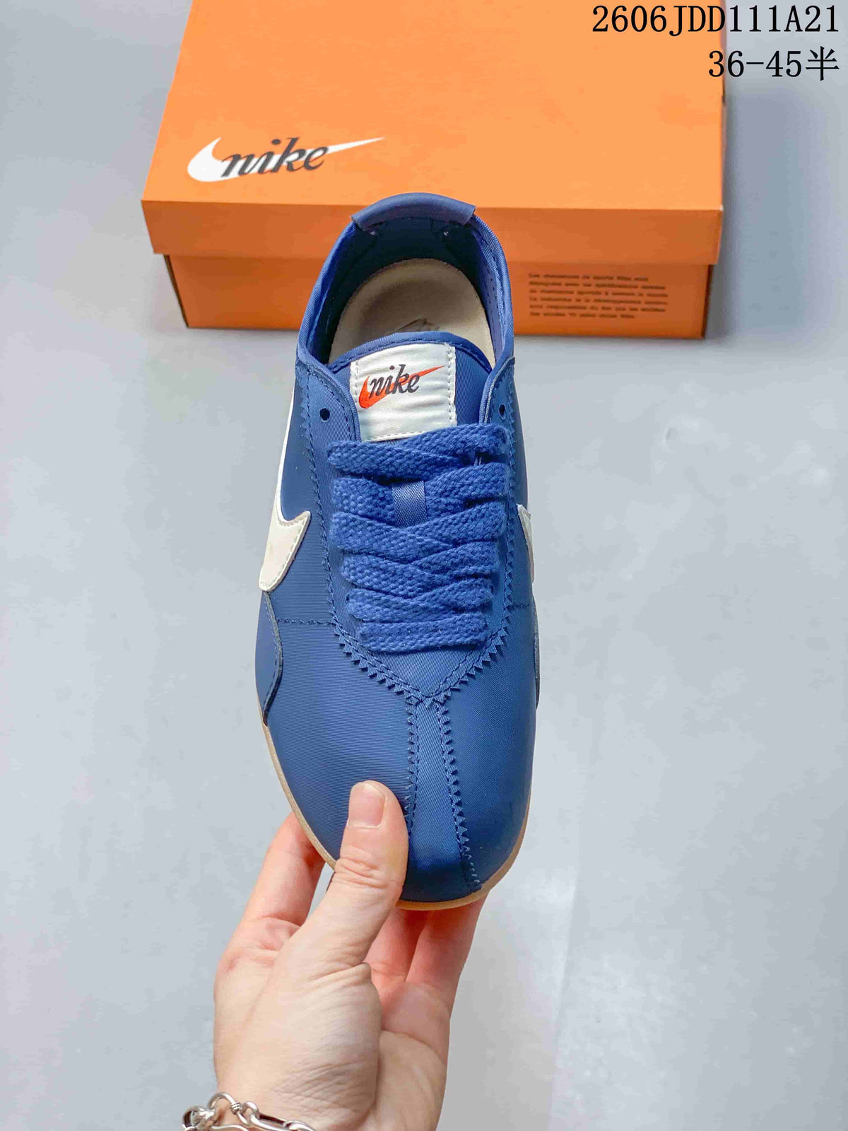 Top view of the blue lace-up sneaker with stitched overlays
