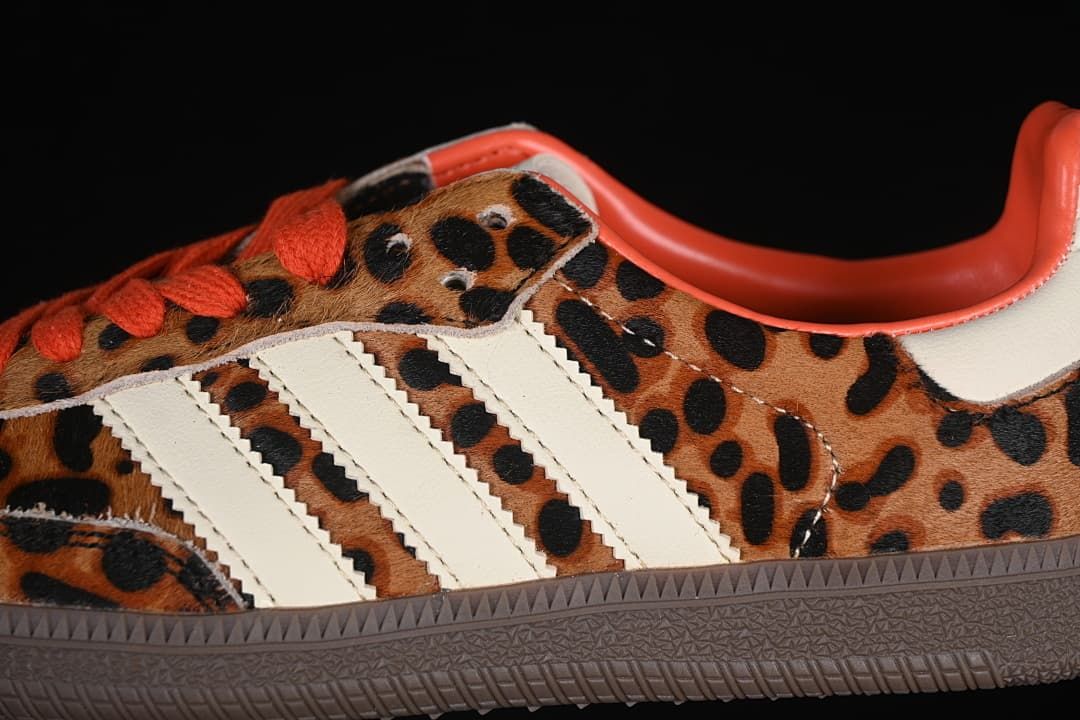 Close-up of the leopard-print upper, cream stripes, and orange-red laces