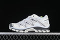 Side profile of a white and grey Salomon XT-Quest shoe