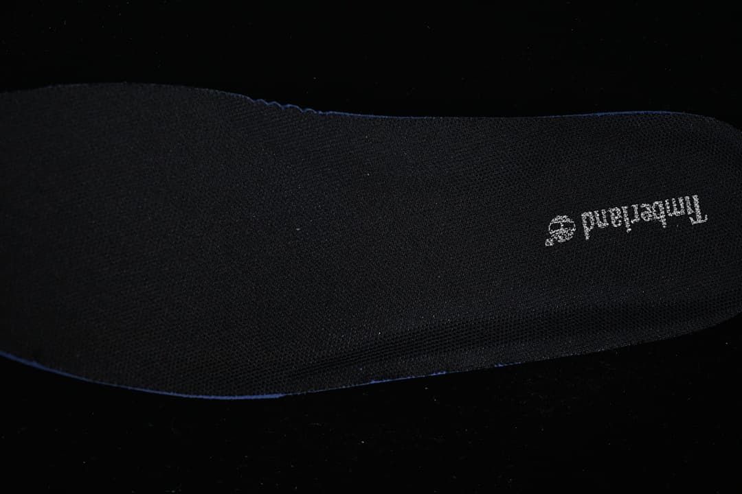 Close-up of a black insole with Timberland branding