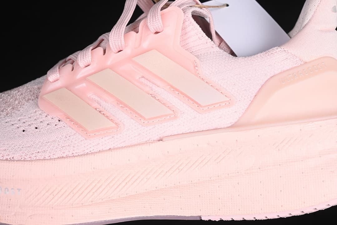 Close-up of the side stripes, knit-look upper and midsole