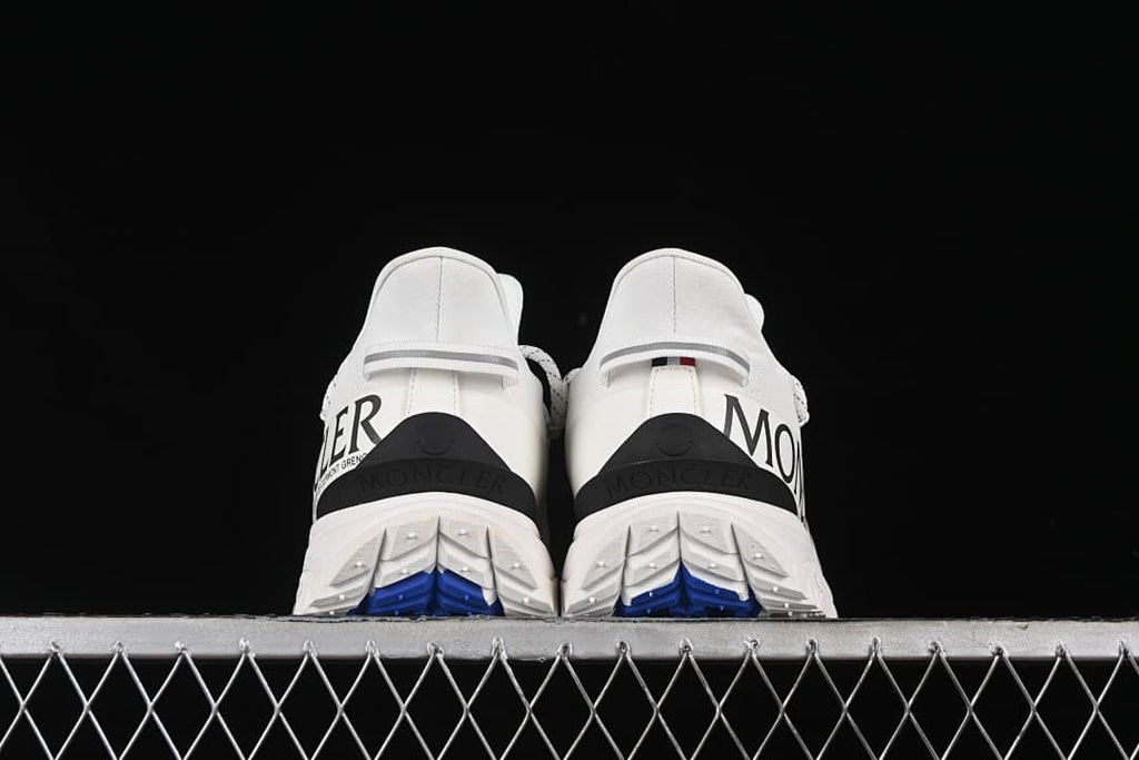Rear view of both shoes showing heel details and outsole