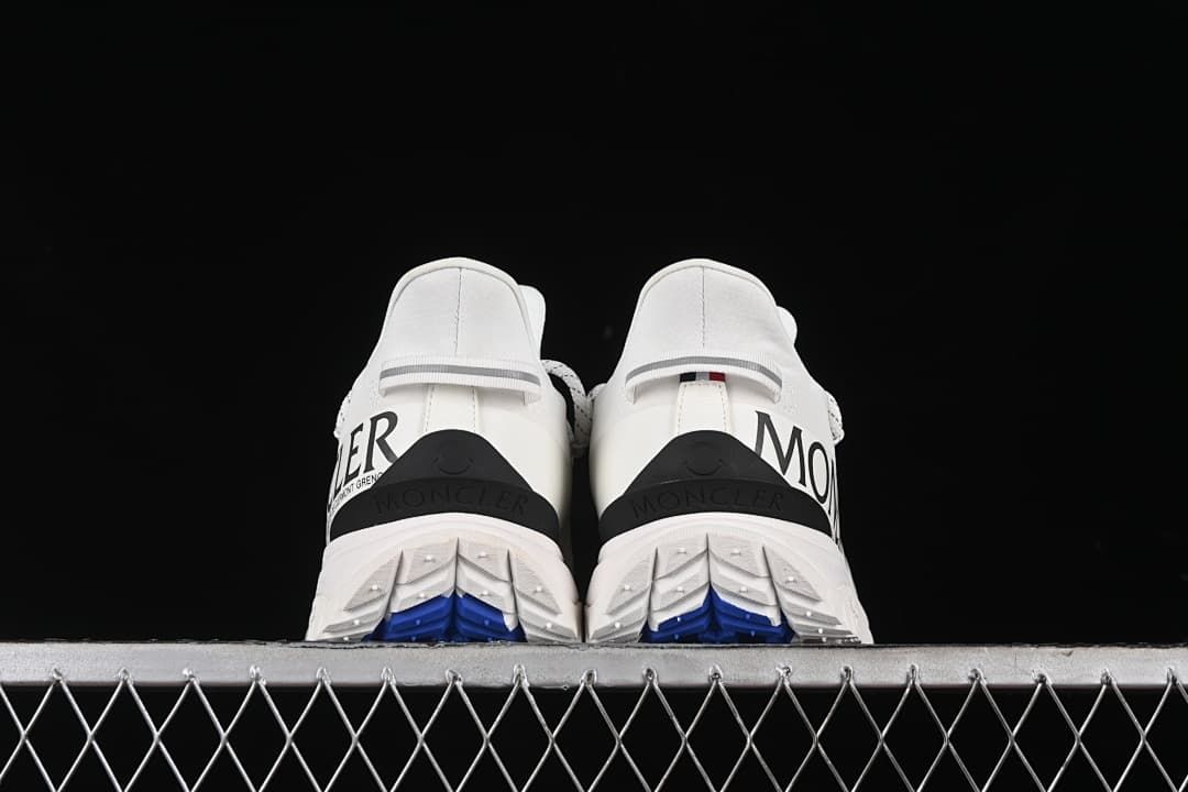 Rear view of both shoes showing heel details and outsole