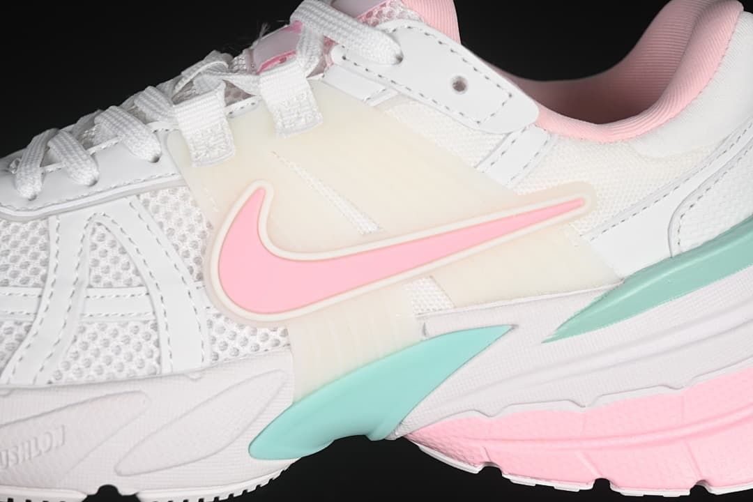 Close-up of the side Swoosh, layered panels, and colored sole accents
