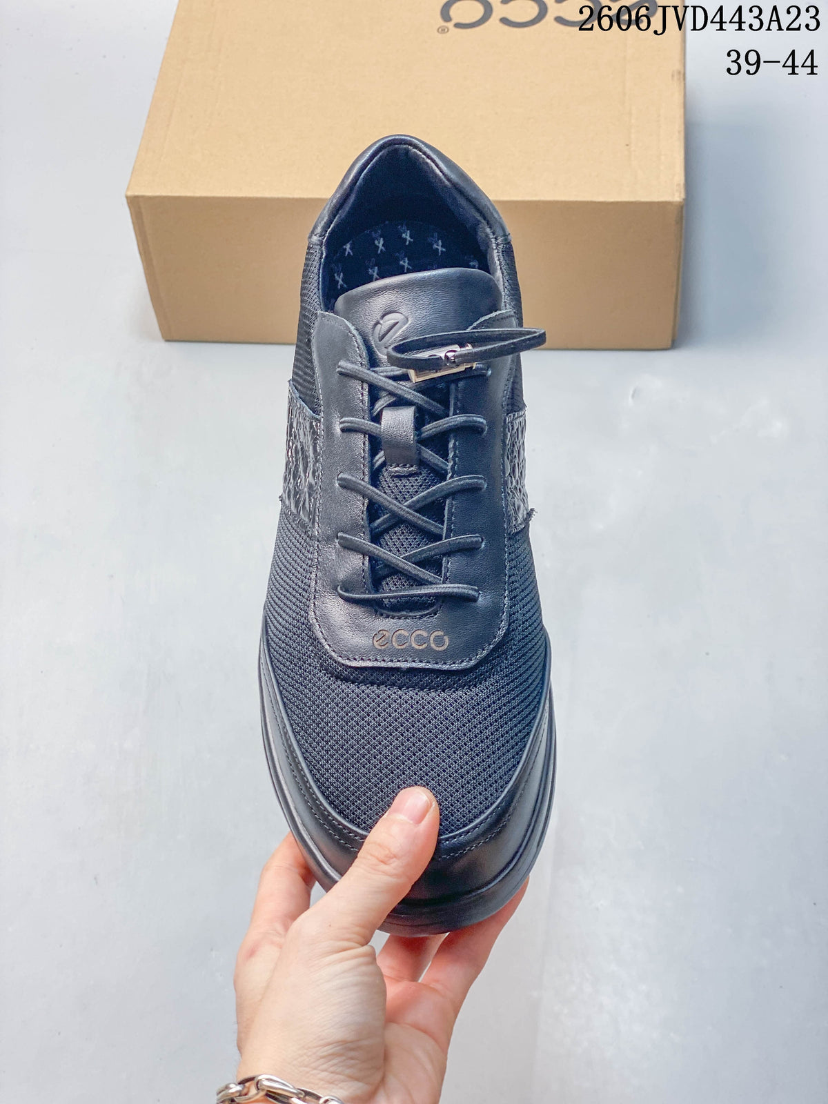 Front view of the navy lace-up sneaker