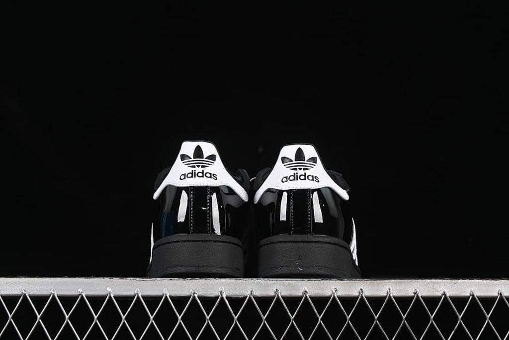 Rear view of the pair showing white heel tabs and black soles