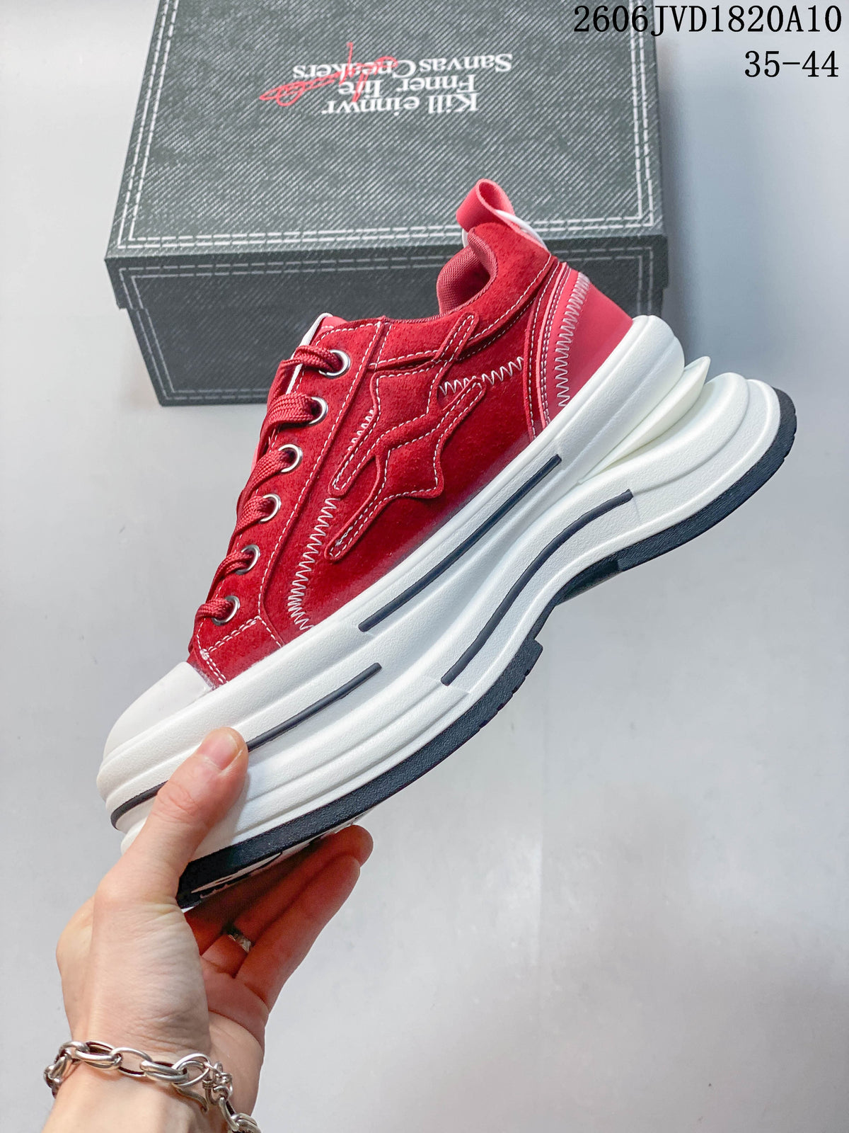Side view of a red low-top sneaker with contrast stitching and a platform sole