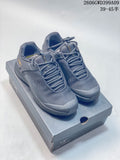 Pair of gray Arc'teryx Kopec low-cut shoes shown on a box