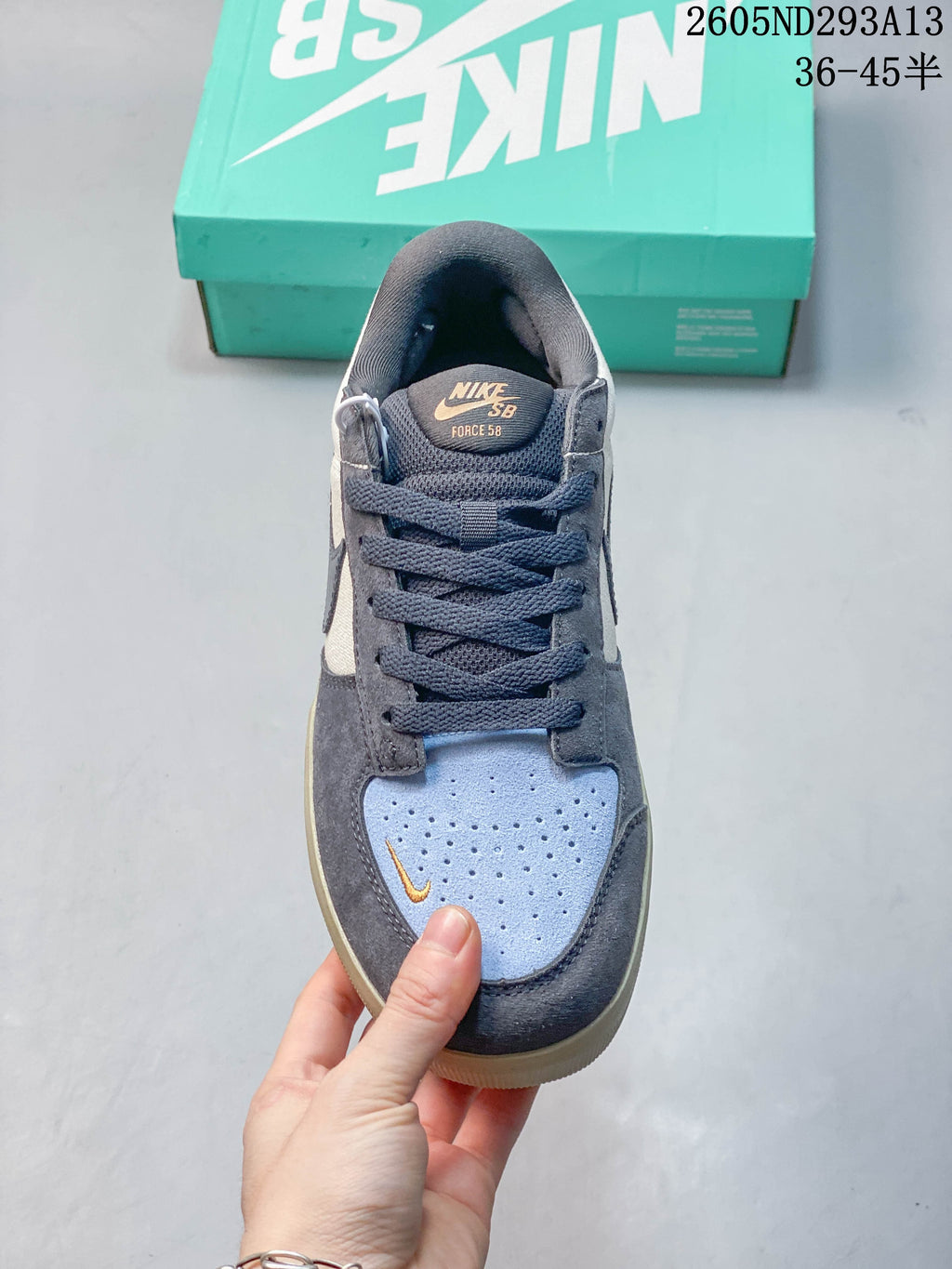 Front view showing the perforated light blue toe panel and dark laces.