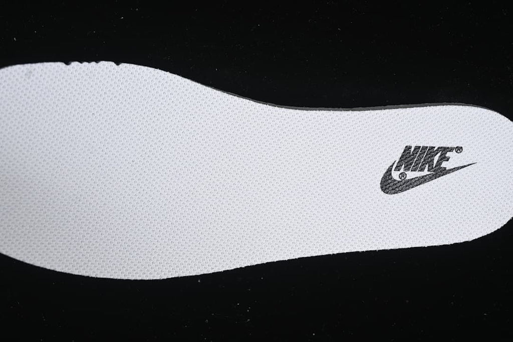 Close-up view of a white insole with a Nike graphic.