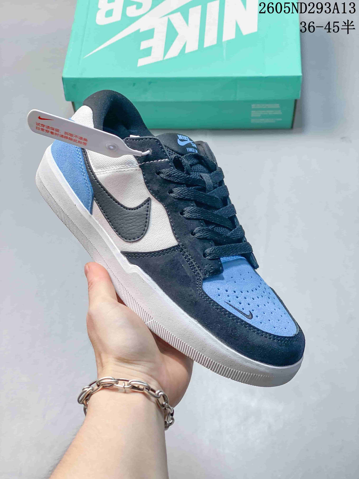 Blue, white and dark navy Nike SB Force 58 low-top sneaker