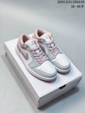 Pair of white and blush-pink low-top Jordan sneakers displayed on a box