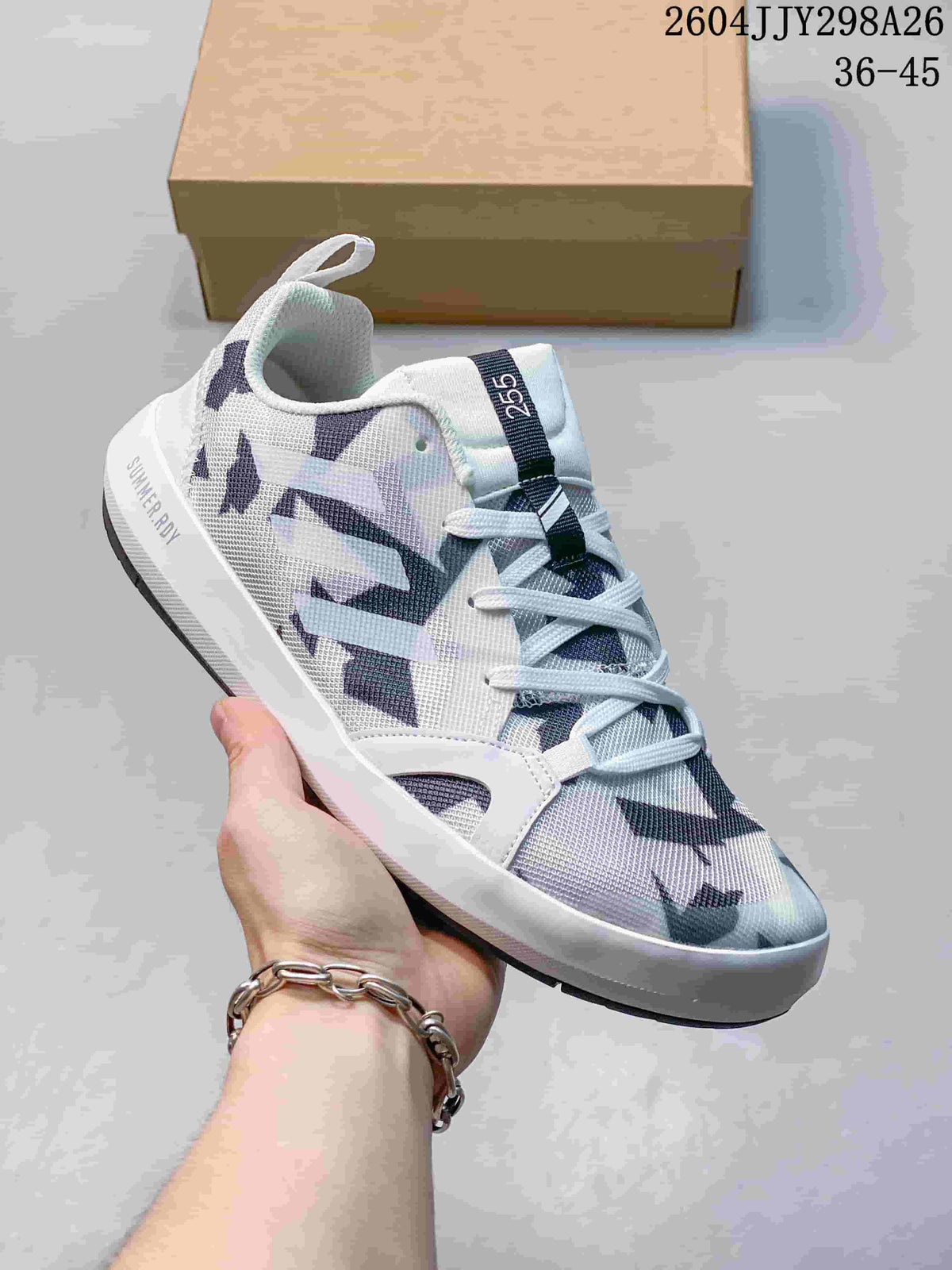 White and dark patterned Adidas Terrex Boat shoe with lace-up fastening.