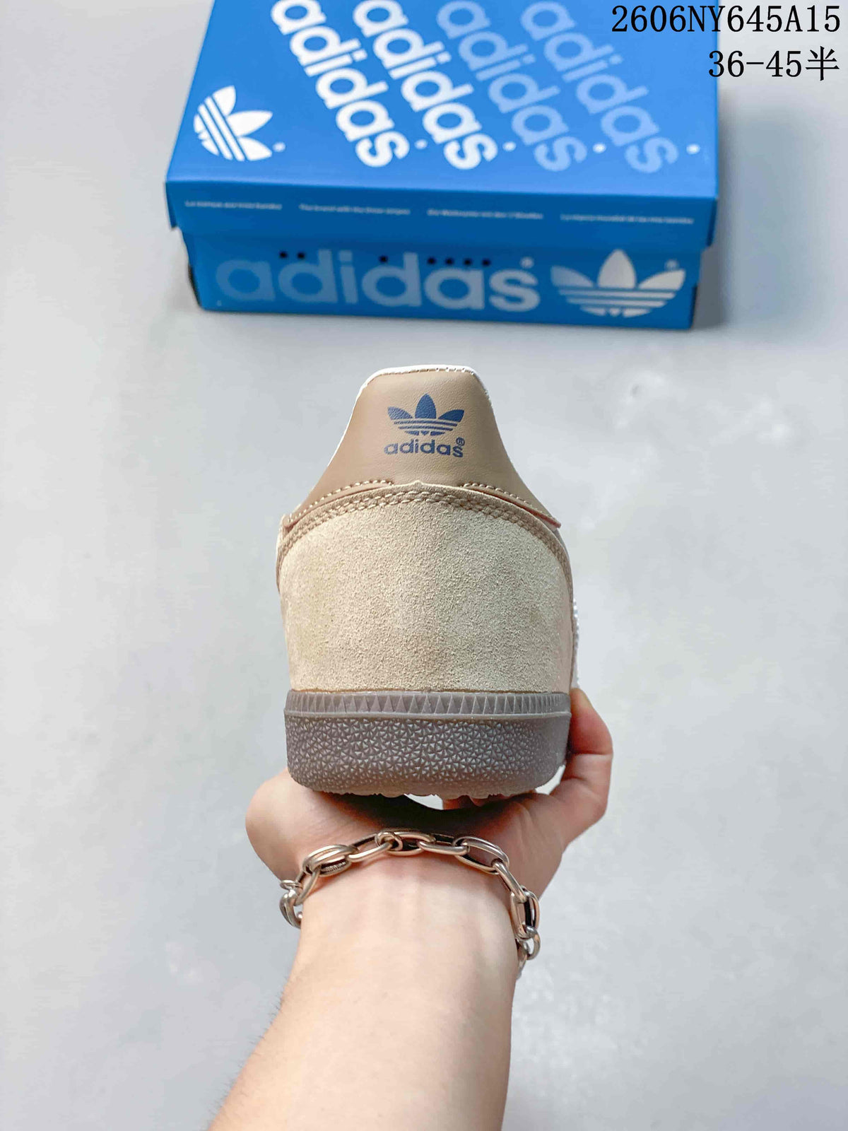 Rear view of the taupe sneaker showing its heel panel and gum-colored sole.