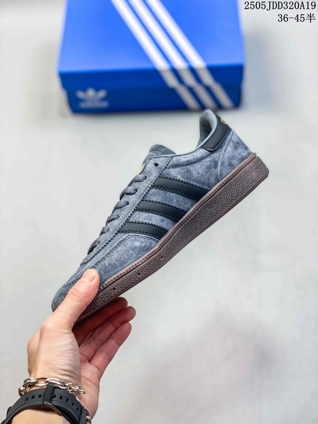 Side profile of a grey Gazelle Indoor sneaker with dark stripes and a gum-colored sole.