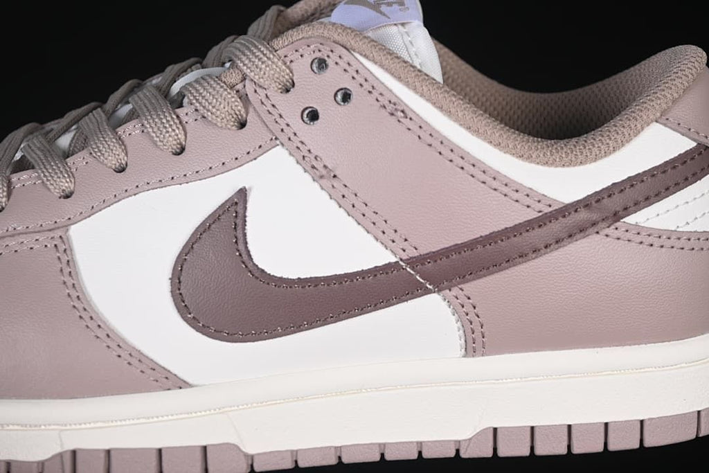 Close-up of the side panels, Swoosh, and lace eyelets.