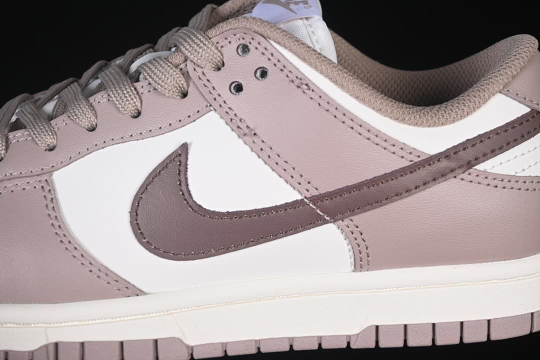 Close-up of the side panels, Swoosh, and lace eyelets.