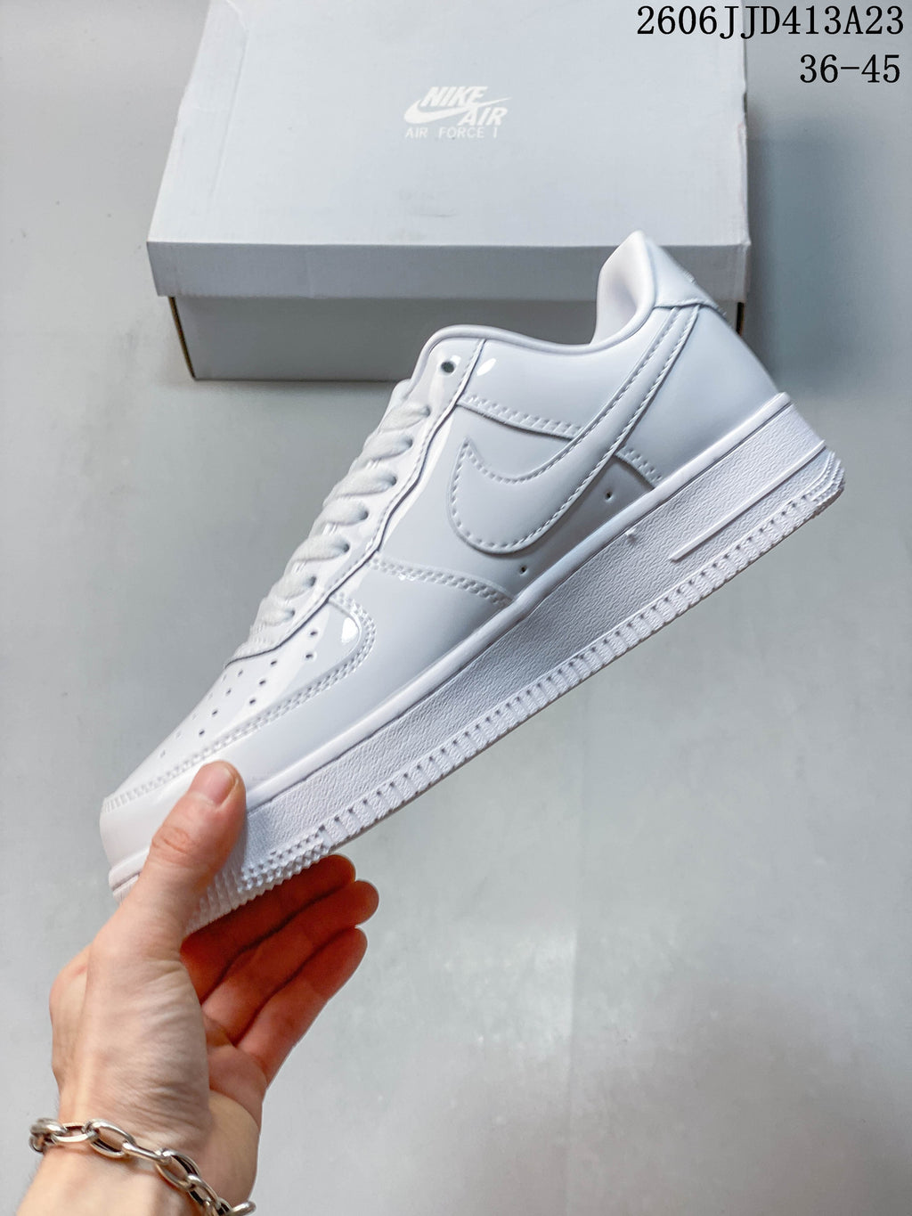 Side profile of the white low-top sneaker with Swoosh detail