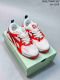 Pair of white and bright red Jordan Heir PF basketball shoes on a shoebox