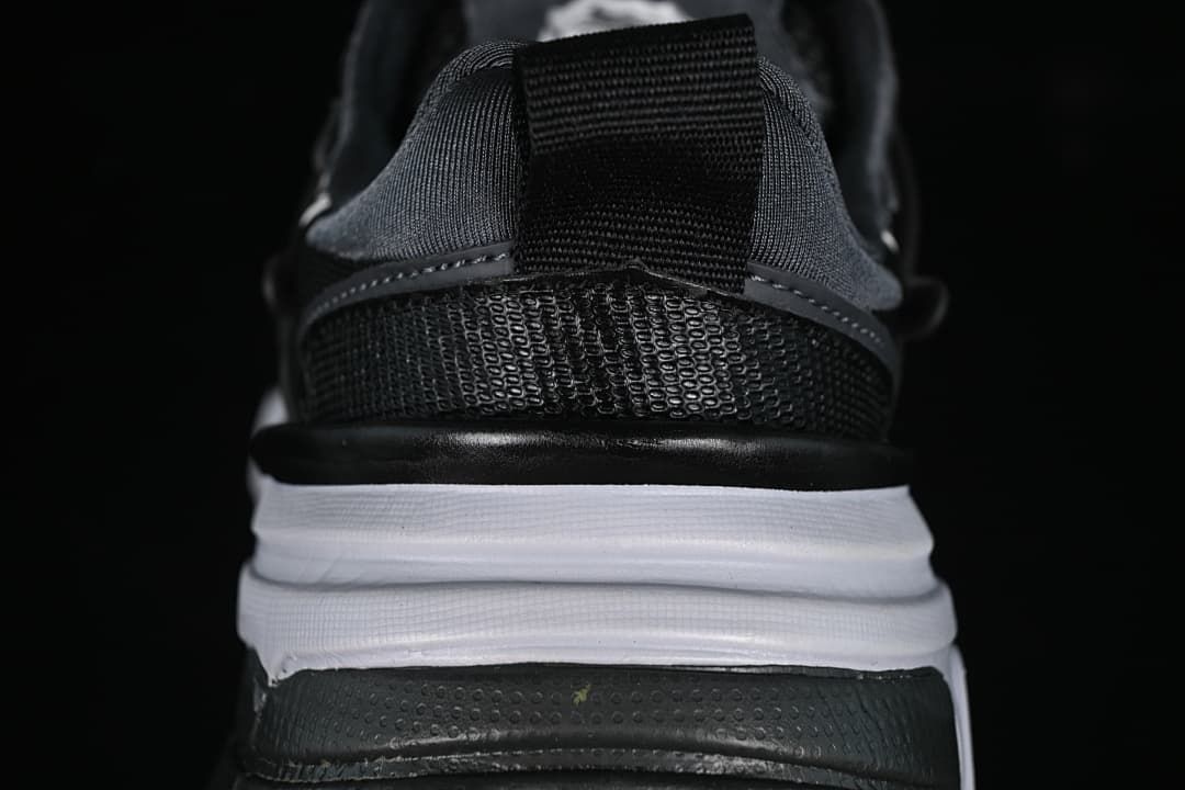 Rear view of the sneaker showing heel pull tab and layered sole