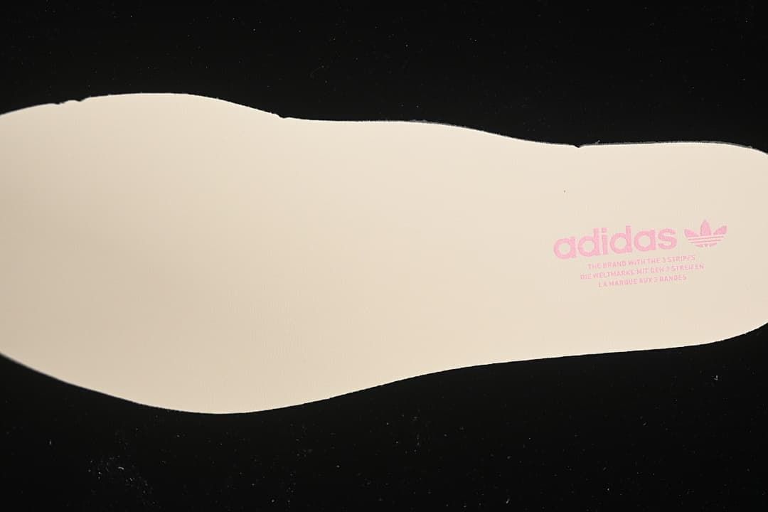 Cream-colored insole with adidas branding