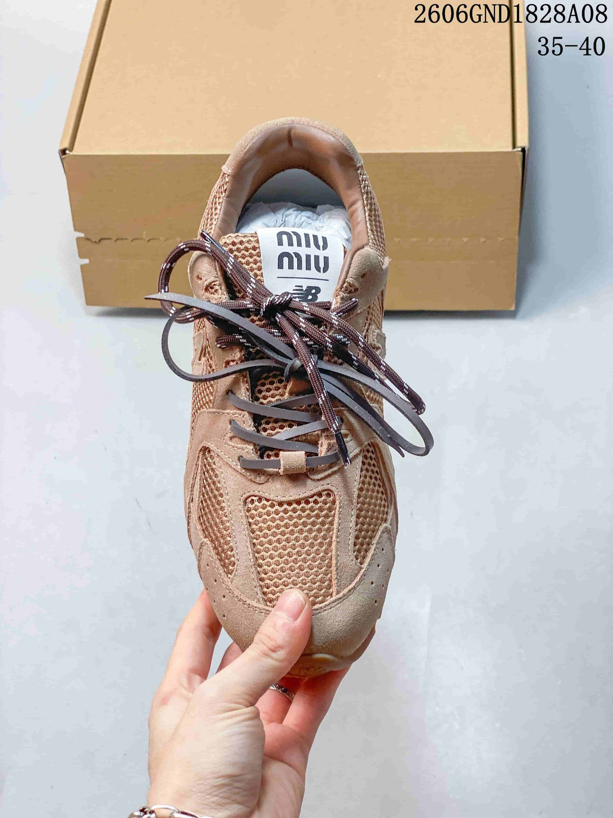 Top view showing mesh panels, mixed-color laces, and tongue branding.